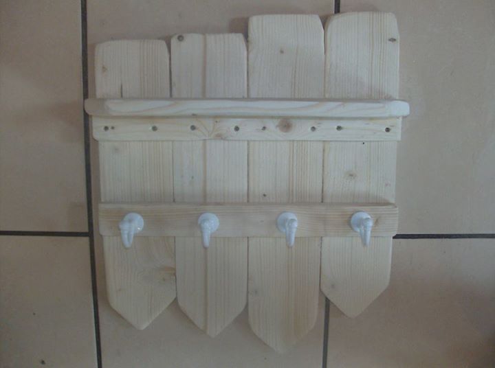 Shelf Made From Pallets With Vintage White Hooks